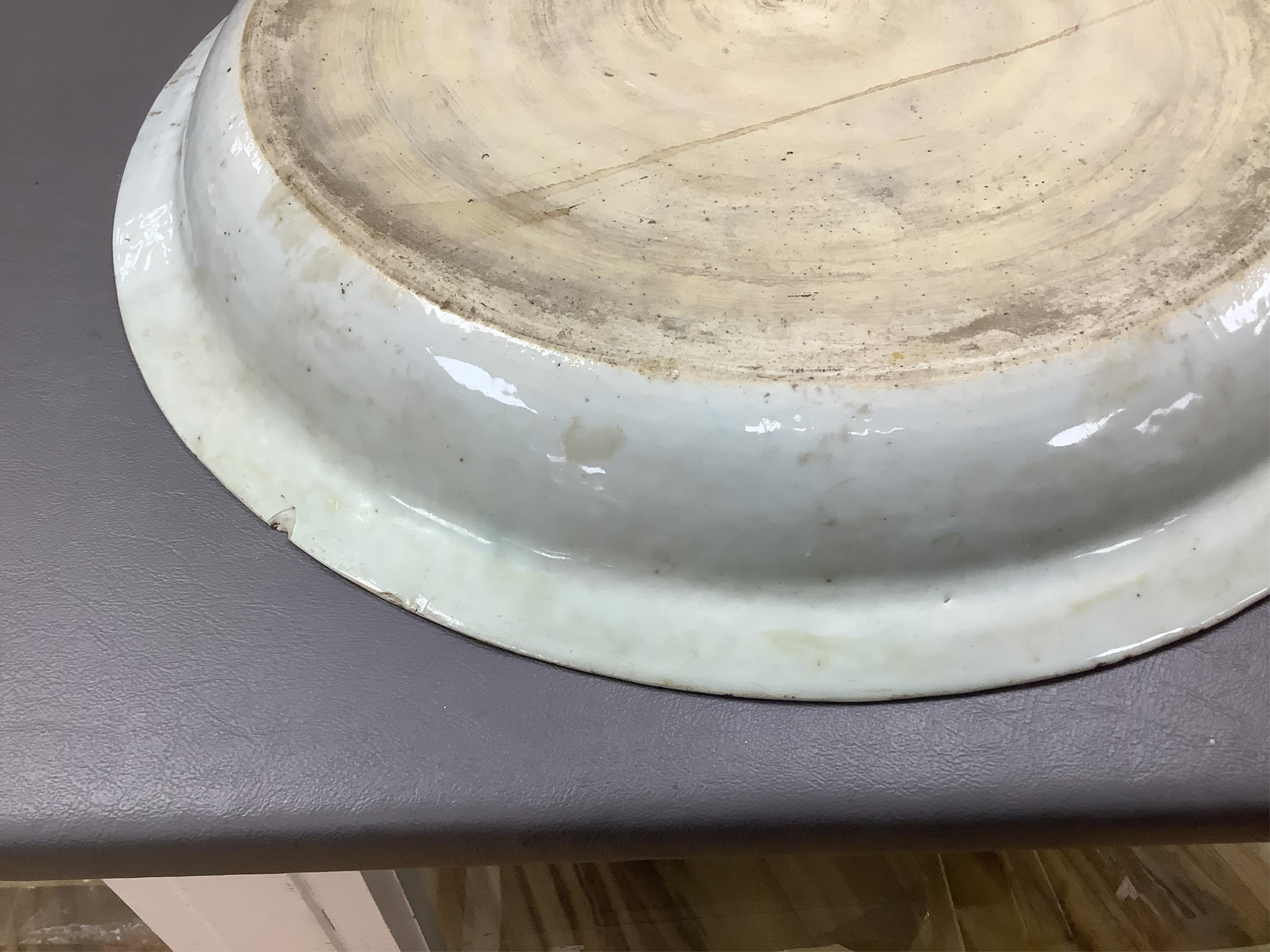 An 18th century Chinese export blue and white chrysanthemum moulded dish, 42cm